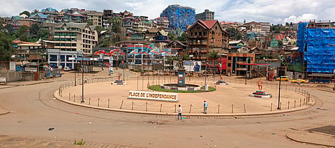 People walk past an independence square in Bukavu, eastern Congo, Saturday, Feb. 15, 2025. 