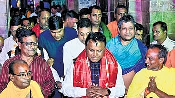 The CM coming out of Sakhigopal temple after offering prayers.