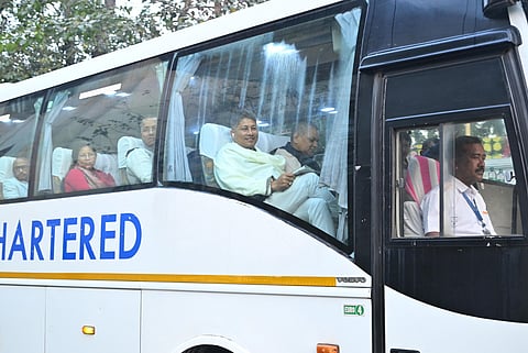 Assam ministers and MLAs travelling in a bus to Kokrajhar on Monday. 