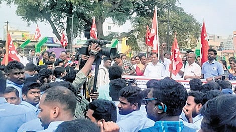 Workers protest with family members at Sunguvarchatram against the suspension of three Samsung India Workers Union members in February 2025.