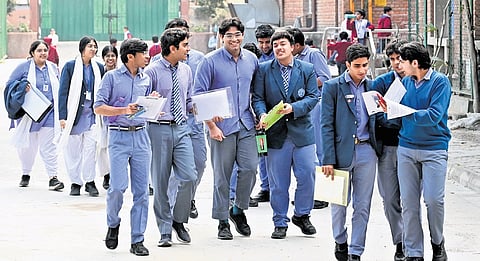 Students leave after appearing for CBSE 12th Board Exam at an examination centre on Monday. 
