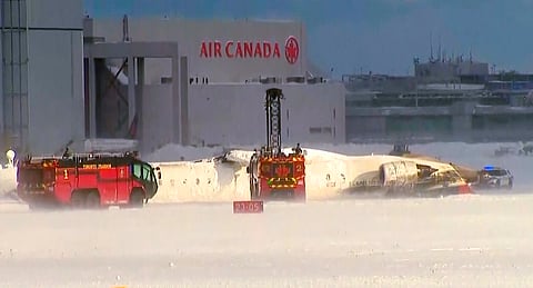 This image taken from video provided by CTV shows emergency crews responding at Toronto Pearson Airport after a plane crash, Monday, Feb. 17, 2025. 