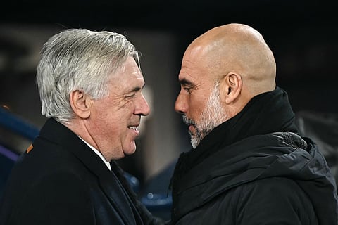 Real Madrid's coach Carlo Ancelotti (L) and Manchester City's manager Pep Guardiola (R) laugh together prior to the UEFA Champions League football match between Manchester City and Real Madrid on February 11, 2025. 