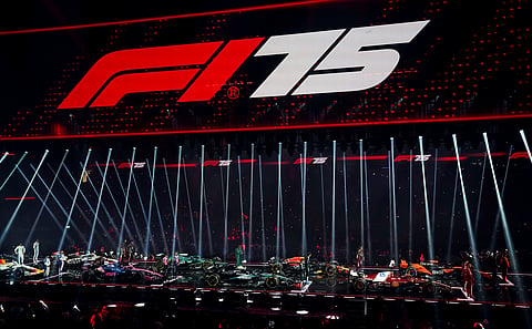 Drivers stand with their new cars during the F1 75 Live event at the O2 arena in London, Tuesday, Feb. 18, 2025.