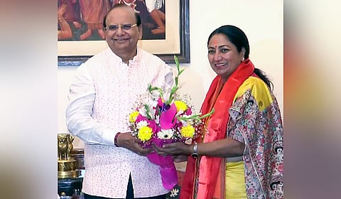 Delhi Lieutenant Governor Vinai Kumar Saxena congratulates BJP MLA Rekha Gupta on being named as the new CM of Delhi by the party during the party legislative meeting, in New Delhi on Wednesday. 