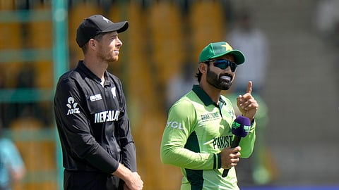 Pakistan's Mohammad Rizwan, right, and New Zealand's Mitchel Santner wait for coin toss before the start the ICC Champions Trophy cricket match between Pakistan and New Zealand, in Karachi, Pakistan Wednesday, Feb. 19, 2025.