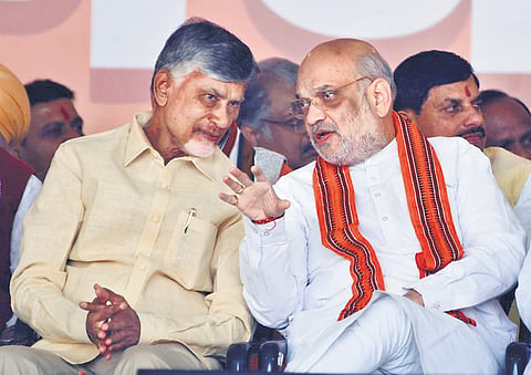 Chief Minister Nara Chandrababu Naidu interacting with Union Home Minister Amit Shah during the swearing-in ceremony of Delhi Chief Minister on Thursday
