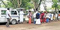 Asraya distributing food packets to the patients and their families
