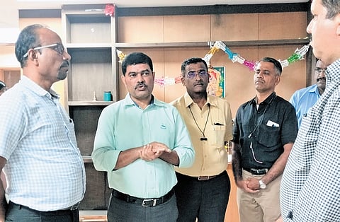 Commissioner of Stamps (left) KV Dayananda listens to the grievances of 
sub-registrars at his office in Bengaluru on Friday  