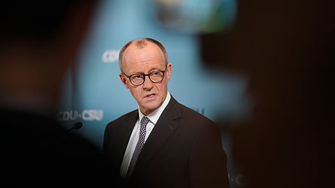 Germany's Chancellor Friedrich Merz speaks to media prior to a faction meeting of the Christian Union party at the Bundestag in Berlin, Germany, Tuesday, Feb. 25, 2025.