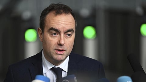 In this photo from Feb. 13, 2025, French Defense Minister Sebastien Lecornu speaks with the media at NATO headquarters in Brussels.