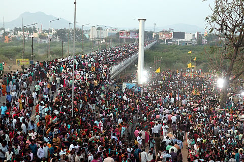 Scores of people gather on Anna Bridge to witness Mayana Kollai festival in Vellore on Thursday.