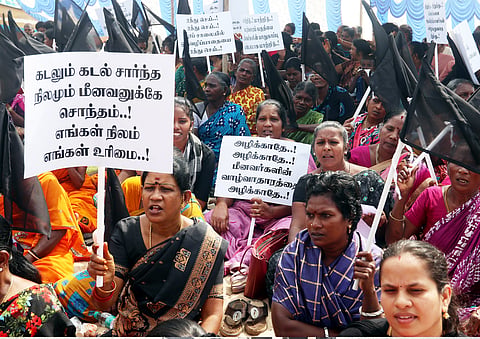 Fisherfolk staging a protest in Srinivasapuram on Friday