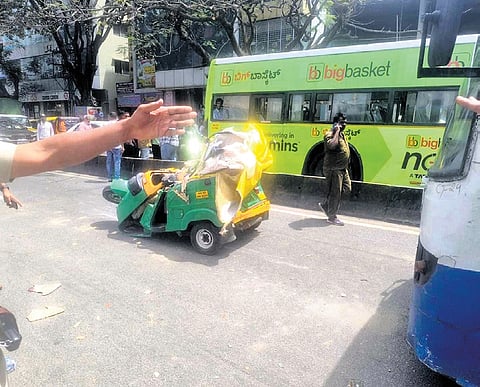Mangled remains of the autorickshaw, which got crushed between two BMTC buses near Hosakerehalli Cross in Banashankari on Friday morning