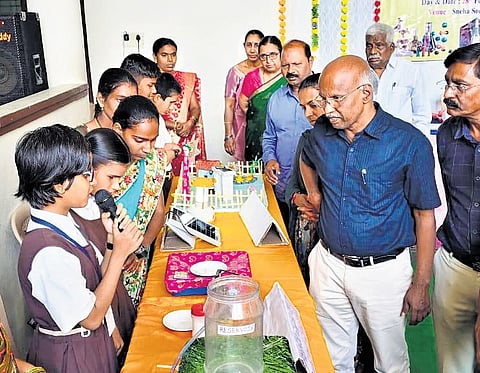 District Educational Officer Parshi Ashok, along with other officials, interacts with students participating in the science exhibition organised by SNESOR in Nizamabad