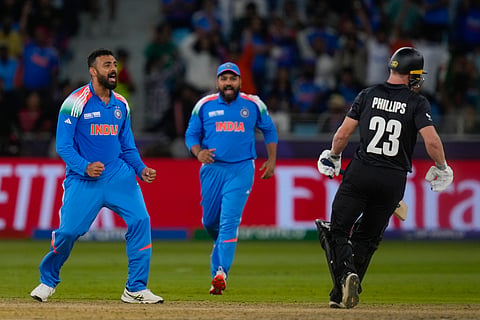 Varun Chakravarthy celebrates a wicket in Dubai on Sunday