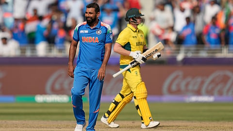 Mohammed Shami celebrates the dismissal of Steve Smith, right, during the ICC Champions Trophy semifinal between India and Australia at Dubai 
