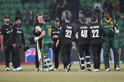South Africa's David Miller,, fourth left, is congratulated by New Zealand's Michael Bracewell on finishing his century during the ICC Champions Trophy semifinal cricket match between New Zealand and South Africa at Gaddafi Stadium in Lahore, Pakistan, Wednesday, March 5, 2025. 