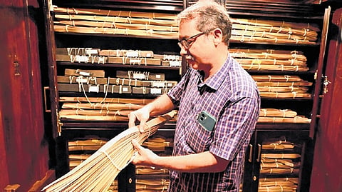 Hari C T, the administrator of the 
proposed Sevadhi museum, displays the palm-leaf manuscripts 