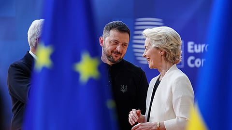 European Commission President Ursula von der Leyen, right, speaks with Ukraine's President Volodymyr Zelenskyy, center, as they arrive for an EU Summit at the European Council building in Brussels, Thursday, March 6, 2025. 
