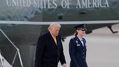 President Donald Trump walks from Marine One before boarding Air Force One, Friday, March 7, 2025, at Joint Base Andrews, Md. 