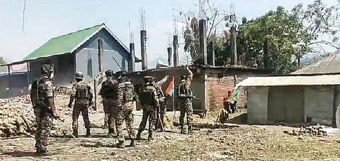 Security personnel stand guard during an indefinite shutdown by the Kuki Zo Council in all the Kuki areas, in Manipur.