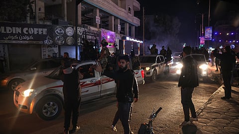 Members of Syria's new security forces prepare to depart from the northwestern city of Idlib, as reinforcement for the coastal area on March 8, 2025. Syrian security forces deployed heavily in the Alawite heartland on the country's Mediterranean coast on March 8, after a war monitor reported that government and allied forces killed nearly 750 civilians from the religious minority in recent days.