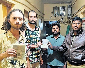 Police assure the safety of foreign tourists at a homestay at Hampi