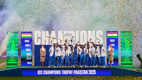 India's players celebrate after winning the ICC Champions Trophy final cricket match against New Zealand