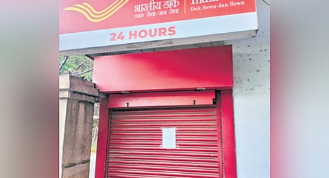  A notice has been pasted outside the shuttered doors of the ATMs announcing the closure. 