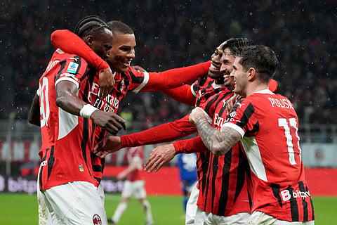 AC Milan's Tijjani Reijnders, second from right, wit teammates celebrates after scoring his side's second goal during the Italian Serie A football match between AC Milan and Como at the San Siro Stadium in Milan, Italy.