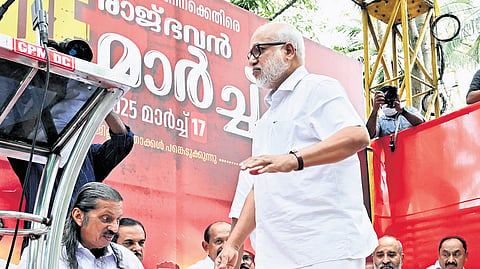 CPM leader M A Baby walks through the stage set up on a mini lorry for the inauguration of LDF’s protest against the Centre at Raj Bhavan on Monday 