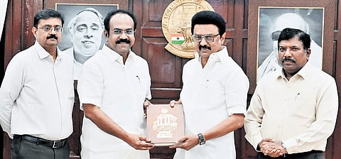 Chief Minister MK Stalin presenting the first copy of the book to Finance Minister Thangam Thennarasu on Monday 