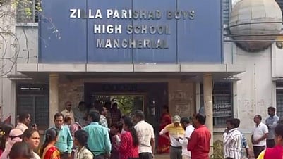 Parents wait outside the ZPHS in Mancherial where Hindi question paper was issued instead of Telugu question paper during the SSC exams.