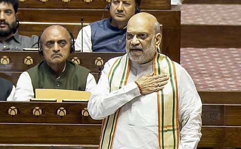  Union Home Minister Amit Shah speaks in the Rajya Sabha during the Budget session of Parliament, in New Delhi, Friday, March 21, 2025. 