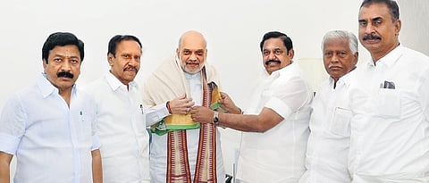AIADMK general secretary Edappadi K Palaniswami and his party colleagues meeting Amit Shah at the Union Minister’s home in New Delhi on Tuesday 