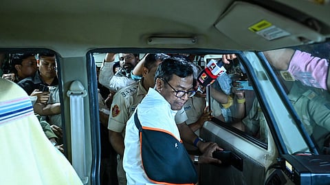 OPCC President Bhakta Das being taken in a police van after party senior leaders and members protest outside the assembly premises against suspension of 12 party legislatures in Bhubaneswar on Tuesday late evening. 