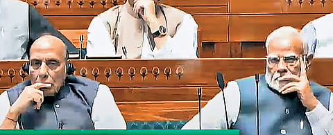 Prime Minister Narendra Modi and Defence Minister Rajnath Singh in the Lok Sabha during the Budget session of Parliament on Wednesday.