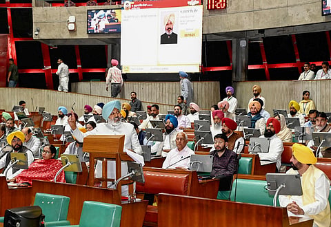Punjab Finance Minister Harpal Singh Cheema presents the state Budget 2025-26, during the Budget session of the state Assembly, in Chandigarh. Punjab Chief Minister Bhagwant Mann is also seen.