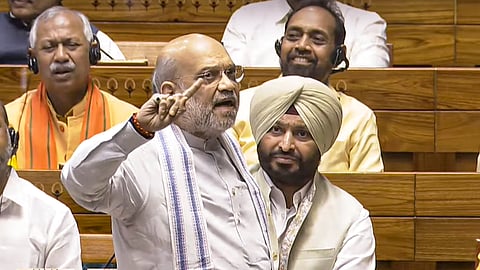 Union Home Minister Amit Shah speaks in the Lok Sabha during the Budget session of Parliament, in New Delhi, Thursday, March 27, 2025.