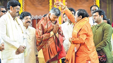 Chief Minister Nara Chandrababu Naidu receiving blessings from Padma awardee Nagaphani Sarma during Ugadi celebrations in Vijayawada