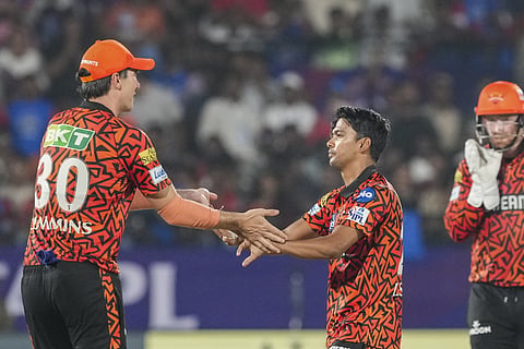 Sunrisers Hyderabad's Zeeshan Ansari celebrates with captain Pat Cummins after taking the wicket of Delhi Capitals' KL Rahul during an Indian Premier League (IPL) 2025 T20 cricket match between Delhi Capitals (DC) and Sunrisers Hyderabad (SRH), at the ACA-VDCA International Cricket Stadium, in Visakhapatnam, Andhra Pradesh, Sunday, March 30, 2025.