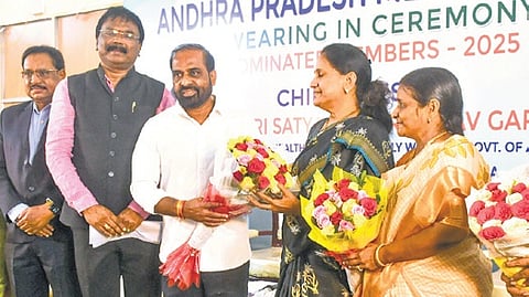 Health Minister Satya Kumar Yadav congratulates nominated members after their swearing as the members of the Andhra Pradesh Medical Council at NTR Health University in Vijayawada on Tuesday. 
