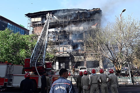 Firefighters try to douse fire at Jhandewalan area on Tuesday 