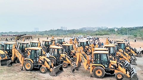 This file image shows Buldozers lined up at the University of Hyderabad campus 