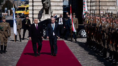 Israeli Prime Minister Benjamin Netanyahu, right, and Hungarian Prime Minister Viktor Orban, left, participate in a welcoming ceremony with a guard of honor at Buda Castle in Budapest, Hungary, April 3, 2025. 