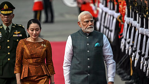 Thailand's Prime Minister Paetongtarn Shinawatra and Prime Minister Narendra Modi walk past a guard of honour during a welcome ceremony at Government House in Bangkok on April 3, 2025, as the Indian leader arrives to attend the 6th Bengal Initiative for Multi-Sectoral Technical and Economic Cooperation (BIMSTEC) summit.