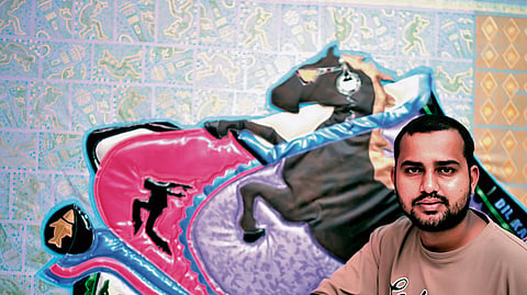 Rajesh Naik with an artwork at the recent exhibition