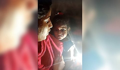 Screen grab of the 6-month-old baby and her mother who got trapped in the lift in Moolakothalam 