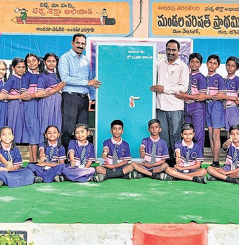 Graduating students present an iron almirah to the school in Gullakota, Jagtial district, on Wednesday